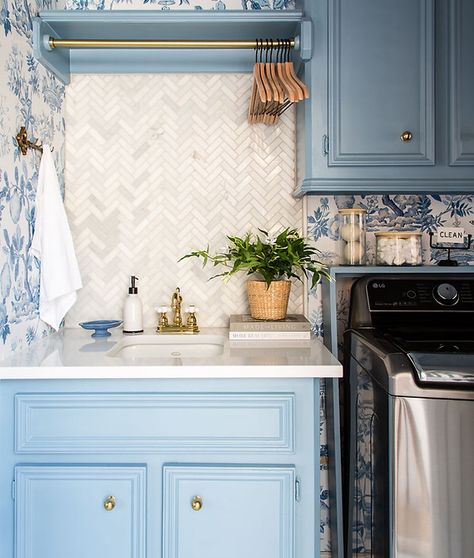 Herringbone Marble Backsplash, Blue Laundry Room, Marble Herringbone Tile, Brown Countertop, Blue Laundry Rooms, Marble Herringbone, New Washer And Dryer, Stylish Laundry Room, Old Fireplace