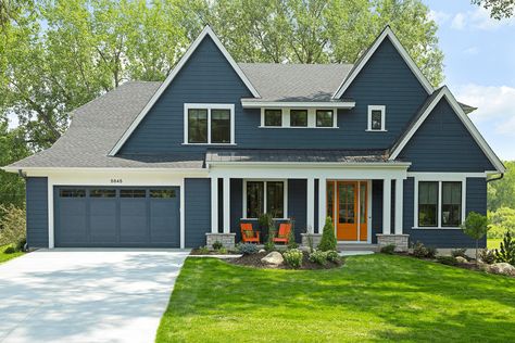 Navy Blue House Exterior, Modern Transitional Exterior, Navy Interior Design, Navy House Exterior, Navy Blue Houses, Brick Paint Colors, Orange Front Doors, Navy Houses, Transitional Exterior