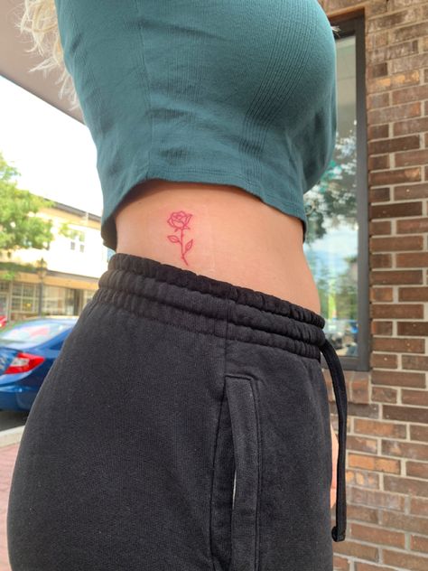 Hidden Rose Tattoo, Word Rose Tattoo, Fine Line Red Ink Rose Tattoo, Rose Placement Tattoo, Red Rose Spine Tattoo, Rose Tattoo Placement Ideas For Women, Fine Line Red Rose Tattoo, Red Rose Tattoo Outline, Red Side Tattoo