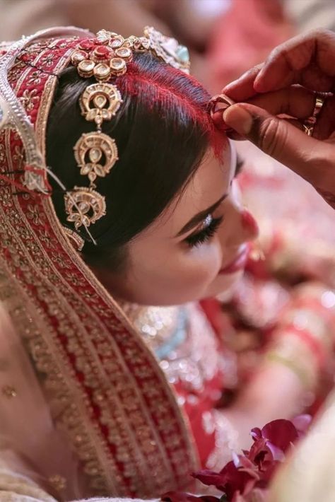 Did you know that sindoor is a mark of love, trust, respect and marriage? Here's an exciting insight into the rituals of Indian Wedding. #indianwedding #indianbride #indianweddingphotography #indianbride #sindoor #sindoorinhair #sindoor #traditions #weddingphotography #weddingphotographer #style #styleinspiration #styleicon Indian Wedding Photography Ideas, Hindu Wedding Rituals, Indian Wedding Rituals, Hindu Wedding Photos, Indian Wedding Aesthetic, Middle Class Family, Marriage Poses, Indian Wedding Pictures, Class Family