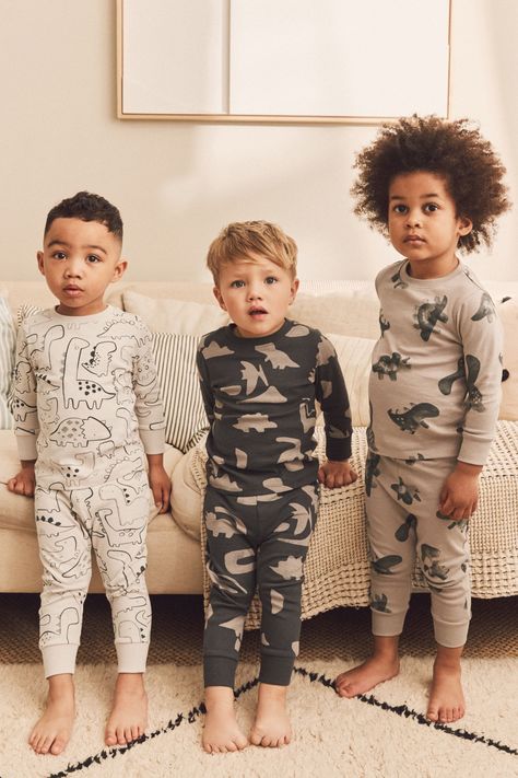 This adorable 3-pack of snuggle pyjamas is available in a selection of cute character designs, boasting a comfortable pure cotton construction with elasticated waist bottoms and ribbed cuffs. Machine washable. 3 x Pyjama Top and 3 x Pyjama Bottom 100% Cotton. Brown Dinosaur, Black Dinosaur, Boys Christmas Pajamas, Boys Pjs, Boys Nightwear, Boys Sleepwear, Kids Nightwear, Kids Pjs, Night Suit