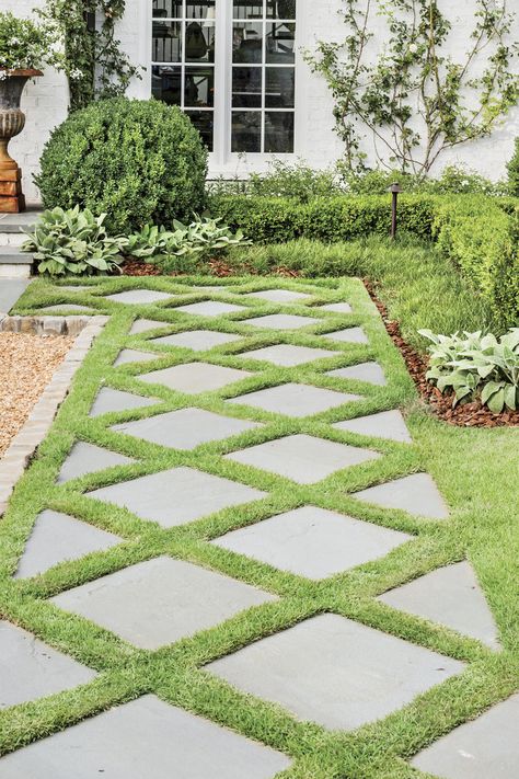 How do you catch the eyes of passersby? Design a welcoming path. Dorlon pulled inspiration for this diamond-patterned one from an existing exterior feature. #landscaping #gardening #southernliving Stone Grass Walkway, Walk Path Landscape, Grass Design Pattern, Stones In Grass Walkway, Stepping Stones With Grass In Between, Grass Stone Walkway, Unique Walkways To Front Door, Criss Cross Grass Patio, Stone And Grass Driveway