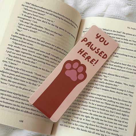 Happy #nationalbookloversday ! I’m so happy that I’m releasing my bookmarks on this day!!! Here’s one of my themes , I also have this available in doggy paws as well! These are completely handmade , hand drawn , and made with love! They’re laminated for extra protection as well 🩷 Share this with someone who loves cats!!! . . . #bookmarkshop #bookmarkart #catloverclub #bookishgirl #bookishart #bookloversofinstagram #bookstagram Bookmark Cat Design, Hand Drawn Bookmarks, Bookmarks Diy, Handmade Bookmarks Diy, Cute Easy Doodles, Bookmarks For Books, Handmade Bookmarks, Creative Bookmarks, Easy Doodles