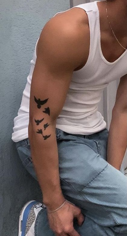 Flying Birds Tattoo Design Men, Birds On Arm Tattoo Men, Men Bird Tattoo Arm, Forearm Bird Tattoos Men, Flock Of Birds Tattoo Men, Small Bird Tattoo Men Arm, Flock Of Birds Tattoo Arm, Birds Wrapped Around Arm Tattoo, Butterfly Tattoo Forearm Men