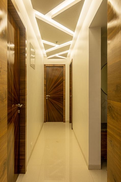 Apartment Styled In Contemporary Design | VASTU AARAMBH - The Architects Diary Lobby Fall Ceiling Design Modern, Lobby Gypsum Ceiling Design, Curvy False Ceiling Design, Foyer Area False Ceiling Design, Passage Area Ceiling Design, Passage Ceiling Design Modern Home, Exterior Ceiling Design, Passage False Ceiling Design, Flat Ceiling Design