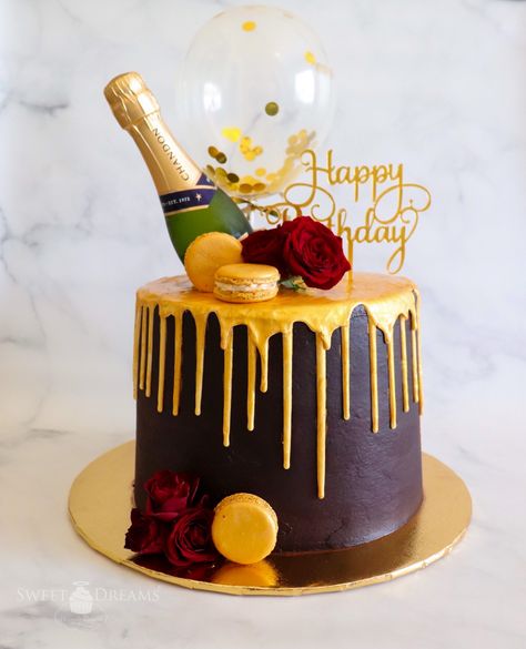 Burgundy Birthday Cake with Gold Drip and Adorned with Macarons, Roses, Mini Champagne Bottle, Glittery Gold Balloon, and Birthday Cake Topper 60 Years Birthday Cake, Champagne Theme Birthday Cake, 18th Birthday Cake Champagne, Champagne Bottle Cake, Cake With Beer Bottle, Wine Theme Cakes, Birthday Cake With Champagne Bottle, Birthday Cake Wine, Beer Bottle Cake