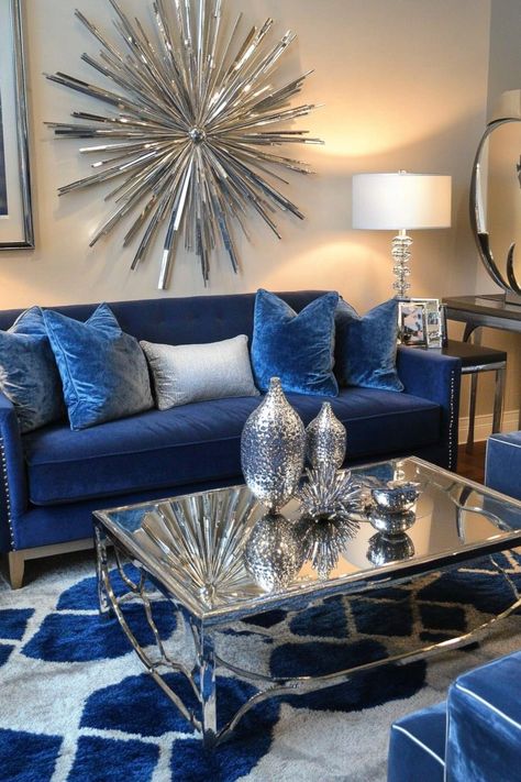 Blue and silver living rooms exude an air of sophistication and tranquility. Explore 26 inspiring ideas that showcase the versatility of this timeless color combination. Discover how to create a space that's both stylish and inviting, using blue and silver accents, furniture, and decor. Find inspiration for transforming your living room into a haven of elegance and comfort. Navy Blue Gray And Gold Living Room Ideas, Show The Most Beautiful Silver Glam Living Rooms, Silver And Blue Living Room, Royal Blue And Grey Living Room, Blue And Silver Living Room Ideas, Blue And Silver Living Room, Royal Blue Living Room Decor, Royal Blue Home Decor, Navy Blue Living Room Decor