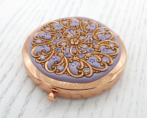 "This listing is for one Classic Push Button Compact with Swarovski Crystals as shown made in Orchid. If you would like more than one, please kindly select your quantity from the drop-down menu during checkout. Please let me know the colors in the \"Note to Seller\" during checkout. Description: This lovely compact is made from metal and features two mirrors inside. One of the mirrors is magnified. It opens with a little push button and snaps closed. The top is embellished with rock-hard clay de Gold Compact Mirror, Real Crystals, Custom Gift Wrapping, Ornate Design, Vintage Purses, Morning Wedding, Pocket Mirror, Gold Filigree, Compact Mirror