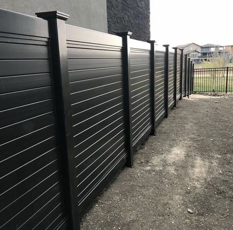 #blackline #commercialfence #vinylfence #commercialfencing #elegantfence #designersofinstagram #blacklinefence #vinylfence #safefence #apartmentfence #local #municipal #municipalfence #fencecontractors #acresofland #fenceforsale #fencedream #landscape #cityfence #fenceimprovement #railing #blackvinyl #vinylrailfence #blackvinylfence #closedpicketfence #fenceinspo #vinylfence #landscapedesign #fencedesign #fencelandscaping Black Semi Private Fence, Modern Slat Fence, Black Stained Wood Fence, Black Fencing Ideas, Modern Black Fence, Vinyl Fence Decorating Ideas, Black Fence Ideas, Metal Roofing Fence, Black Vinyl Fence