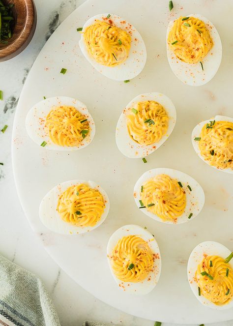 These classic deviled eggs with dill pickle are so nostalgic! With a creamy, tangy filling studded with diced dill pickle and and enhanced with dill pickle juice, these deviled eggs are just like mom used to make (for me, literally!) We love this classic deviled eggs recipe, they're a must for just about any occasion. Deviled Eggs With Dill, Dill Pickle Deviled Eggs, Pickle Deviled Eggs, Classic Deviled Eggs Recipe, Dill Pickle Juice, Jalapeno Deviled Eggs, Deviled Egg Recipes, Recipes With Meat, Classic Deviled Eggs