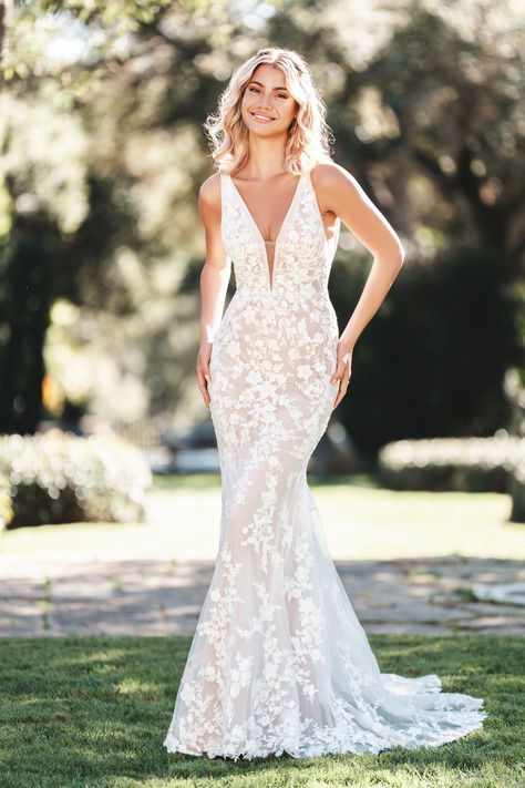 Step into timeless elegance with this stunning Allure Bridals sleeveless sheath gown. Featuring ornate floral lace appliques that beautifully trail down the delicate tulle, this wedding dress is perfect for the bride seeking a blend of romance and sophistication! 

#AllureBridals #SleevelessSheathGown #FloralLaceAppliques #TulleWeddingDress #ElegantBride #BridalFashion #WeddingInspiration #RomanticWeddingDress #LaceWeddingGown #TimelessEleganc V Neck Fitted Wedding Dress, Dapper Bride, Romance Wedding Dress, Sheath Bridal Gown, Allure Romance, Floral Lace Wedding Dress, Sheath Wedding Gown, Girls Bridesmaid Dresses, 2025 Wedding