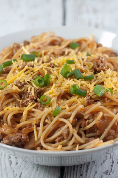 Slow Cooker Chili Spaghetti - Your favorite chili flavors mixed into a crock pot spaghetti recipe. It's made with ground beef, tomato juice, onions, chili powder, cheese, and spaghetti noodles. | CDKitchen.com Chilli With Spaghetti Noodles, Recipes With Tomato Juice In Them, Tomato Juice Recipes Dinner, Recipes Using Tomato Juice, Hillbilly Chili, Chili Spaghetti Recipe, Cabana Recipes, Crockpot Sides, Italian Chili