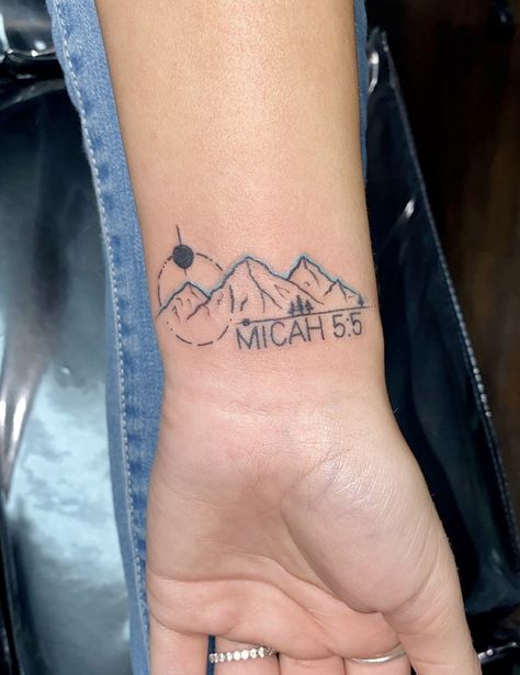 Small wrist tattoo with mountains and geographical patterns with bible verse Mountain Bible Verse Tattoo, Small Bird Tattoos For Women Arm, Wrist Bible Verse Tattoo, Christian Mountain Tattoo, Faith Can Move Mountains Tattoo, Bible Symbols Tattoos, Renewal Tattoo, Tattoo With Mountains, Christian Wrist Tattoos