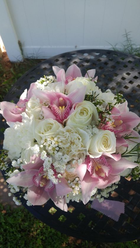 Vintage colored dusty pink and ivory bridal bouquet. Cymbidium orchids, ivory roses, and carnations. #Lighthouseflowershopmesa #vintagebridalbouquet #dustypinkwedding #ivoryandpink #mesaflorist Orchid And Rose Bouquet, Pink Orchids Bouquet, Orchids Bouquet, Roses And Carnations, Blush Wedding Theme, Ivory Bridal Bouquet, Vintage Bridal Bouquet, Dusty Pink Weddings, Prom 2022