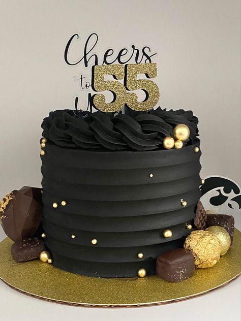 Black buttercream cake decorated with gold balls, chocolates and a cake truffle heart Birthday Cakes For Men Black And Gold, Black Buttercream Cake For Men, Black And Gold Buttercream Cake, Black And Gold Cakes For Men, Black And Gold 50th Birthday Cake, Black And Gold Birthday Cake For Him, Black Gold Cake Birthday, Black Cake For Men, Cake Designs Black And Gold