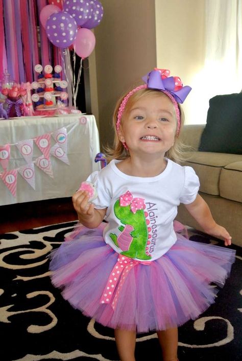 Alaina's 2nd Pink Dinosaur Birthday Party | CatchMyParty.com Dinosaur Birthday Party Outfit, Pink Dinosaur Party, Dinosaurs Birthday Party, Girl Dinosaur Party, Dinosaurs Birthday, Girl Dinosaur Birthday, Dinosaur Birthday Party Decorations, Dinosaur Themed Birthday Party, Birthday Party Outfit