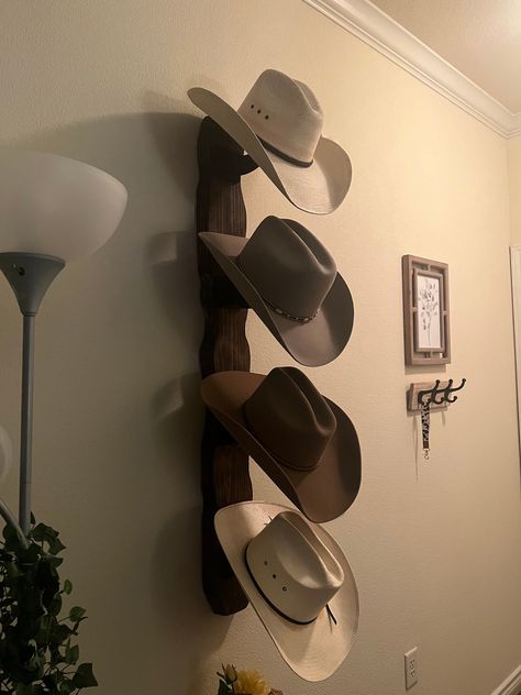 Howdy! Now that this years rodeo season is in full swing and summer is here, I am making a few of these cowboy hat display racks. I am a junior at Sam Houston State University and these will help offset my tuition cost. They are made with pine and have durable plastic hooks that hold each hat at an angle for display. These are meant for indoor use only, and the hooks will warp if left out in the heat. Each hat rack is unique and is one of a kind! There are three available sizes: Small (2 hats): Decorating With Cowboy Hats, Cowboy Hat Hanging On Wall, Cowboy Hat Storage Ideas Diy, Cute Western Decor, Cowboy Hat Hanging Ideas, Horseshoe Wall Decor, Cowboy Hat Wall Display, Western Room Ideas Bedrooms Cowboy Theme, Apartment Decorating Western