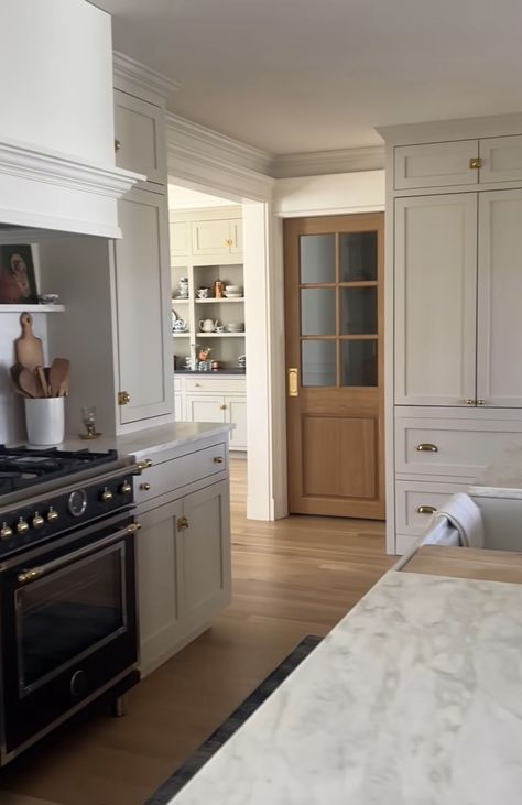 Kitchen To Mudroom Transition, Open Galley Kitchen With Peninsula, Stove With Window Behind It, Clean Modern Interior, Kitchen With Pass Through To Living Room, Wood Cased Openings Between Rooms, Pass Through Pantry, Fridge And Stove Side By Side, Soft White Kitchen