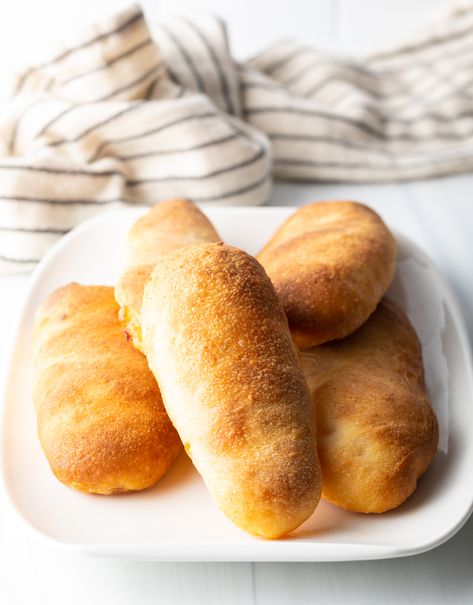 This classic West Virginia Pepperoni Rolls recipe includes flavorful slices of pepperoni and gooey mozzarella cheese, baked inside soft homemade pizza dough. Like a homemade hot pocket but WAY better :) | A Spicy Perspective Pepperoni Roll Dough Recipe, Peperoni Rolls Homemade, Sourdough Discard Pepperoni Rolls, Sourdough Pepperoni Rolls, Wv Pepperoni Rolls Recipe, West Virginia Pepperoni Rolls Recipe, West Virginia Pepperoni Rolls, Easy Pepperoni Rolls, Classic Pizza Dough Recipe