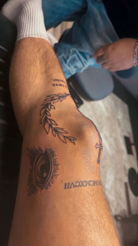 Small Mens Leg Tattoos, Laurel Wreath Tattoo Knee Men, Greek Leg Tattoo Men, Minimal Leg Tattoo Men, Guys First Tattoo Ideas, Game Of Life Tattoo, Leg Patch Work Tattoo Men, Masculine Arm Tattoos, Around Knee Tattoo Men