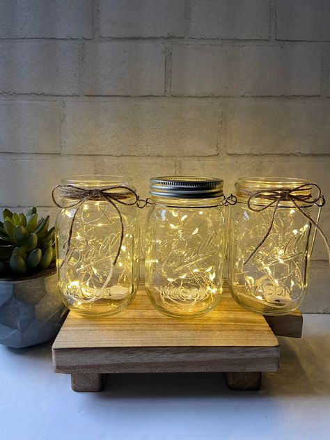 Boho Lights Wedding, Mason Jars Centerpieces, Lighted Mason Jars, Cheap Centerpieces, Fairy Lights In A Jar, Wedding Centerpieces Mason Jars, Gold Mason Jars, Lighted Centerpieces, Deck Table