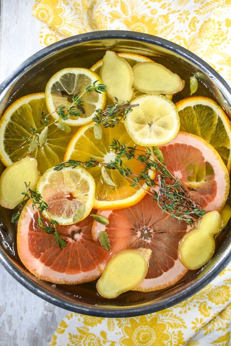 A fragrant citrus simmer pot recipe with lemon, orange, grapefruit, ginger, cardamom and thyme. This easy citrus stovetop potpourri offers a natural alternative to candles, diffusers, and artificial sprays. Recipe With Lemon, Simmer Pot Recipes, Potpourri Recipes, Citrus Recipes, Simmer Pot, Lemon Ginger, Dried Oranges, Stovetop Potpourri, Oranges And Lemons