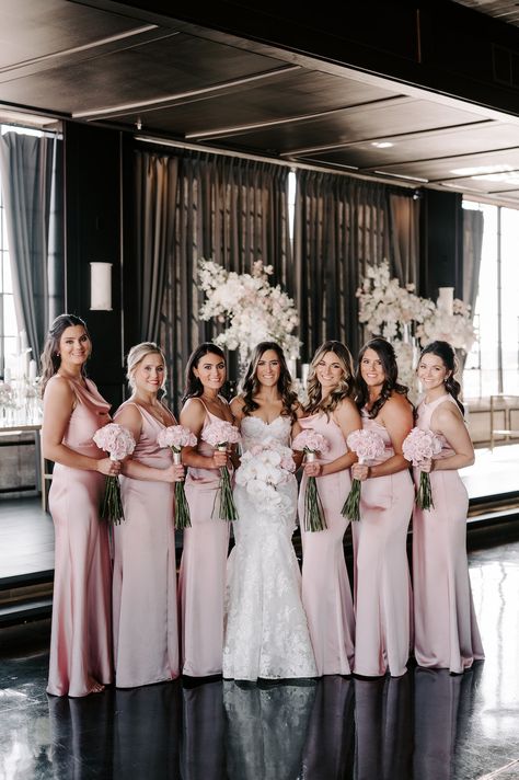 The bride and bridesmaids posing in blush pink gowns with blush bouquets. Black Pink Bridesmaid Dresses, Blush Pink Bridesmaid Dresses Mismatched, Black And Pink Bridesmaid Dresses, Pearl Pink Bridesmaid Dresses, Champagne Pink Bridesmaid Dresses, Black And Light Pink Wedding, Pink Black White Wedding, Champagne Pink Bridesmaid Dress, Wedding Pink Bridesmaid Dresses