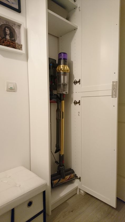 Ikea Hack. #ikeahacks Your Dyson vacuum fits into the smallest Ikea Billy Book case. Storage Cabinet For Vacuum, Dyson Hoover Storage, Pull Out Vacuum Storage, Ikea Laundry Cupboard, Broom Closet Ikea, Entry Closet Organization Vacuum, Hiding Dyson Vacuum, Closet For Dyson, Vacuum Storage Ideas No Closet