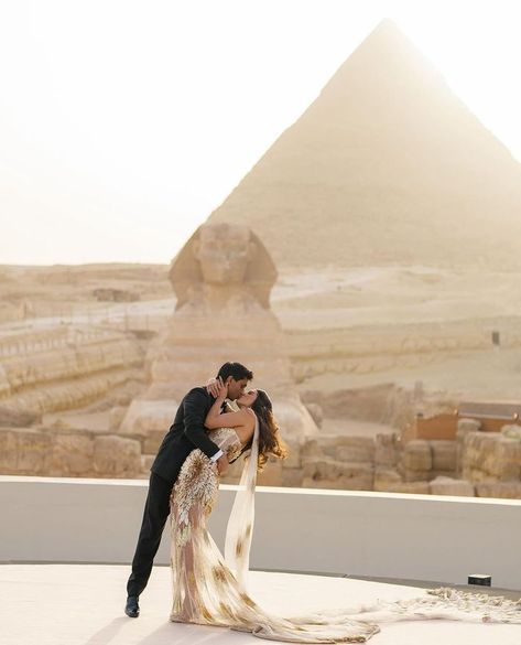 A Wedding Like Never Before- This Couple Got Married At The Pyramids In Egypt! | WedMeGood Wedding Egypt, Pyramid Wedding, Egypt Wedding, Egyptian Wedding, Candid Couple, Silver Evening Dress, Robin Thicke, Couple Shots, Egyptian Pyramids