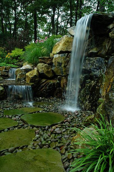 Bluestone stepping stone lead through the 7' natural waterfall and stream. Project by Deck and Patio Company Huntington Station New York. Read more- http://www.deckandpatio.com/DP_Blog/?p=1013 Taman Air, Natural Waterfalls, Fountains Backyard, Garden Waterfall, Pond Waterfall, Pond Water Features, Backyard Water Feature, Waterfalls Backyard, Backyard Renovations