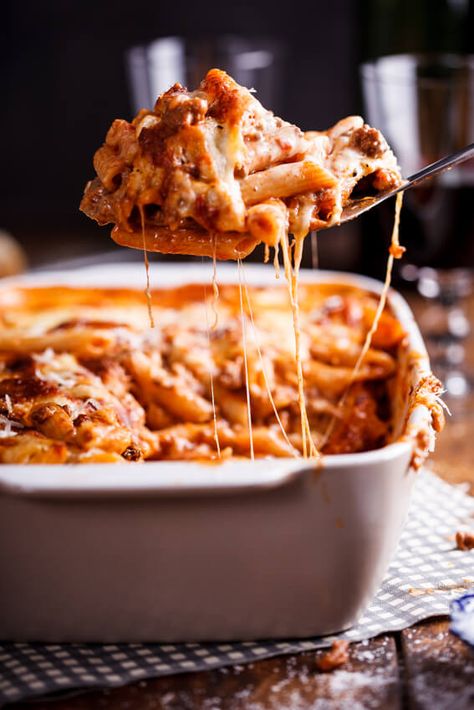 This rich and aromatic bolognese pasta bake is perfect for busy weeknights or feeding a crowd as it can easily be made in bulk and frozen. #comfortfood #winterdinner #dinnerrecipe #easyrecipe #pasta #casserole #pastabake #bolognese Ziti With Sausage, Cheesy Baked Ziti, Bolognese Pasta Bake, Ziti Al Forno, Baked Ziti With Sausage, Bolognese Pasta, Baked Pasta Dishes, Easy Baked Ziti, Ziti Recipes