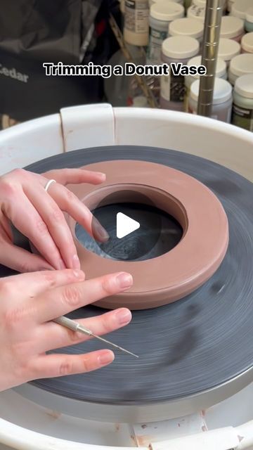 66K views · 1.6K likes | Cheri Downey | Ceramicist on Instagram: "This is trimming a donut vase that was thrown on the wheel! Since it was thrown, it has a flat bottom and needs to be trimmed so that both sides are rounded. Towards the end of the video, I tap it to create a flat side so it can sit nicely. I cut a whole at the top and will attach a neck shortly after! 

#ceramics #pottery #potteryasmr #ceramicart #supportsmallbusiness #giftideas #homedecor #mug #handmadevase #donutvase #donutvasetutorial #madeinaskutt #fired #ceramicvase #potterytrimming #trimmingpottery #wheelthrown #mugshot #brownspeckledclay #speckledclay" Wheel Thrown Vases, Thrown Ceramics Ideas, Donut Pottery, Pottery Wheel Ideas, Wheel Thrown Mugs, Clay Wheel, Donut Vase, Big Vases, Handmade Vase