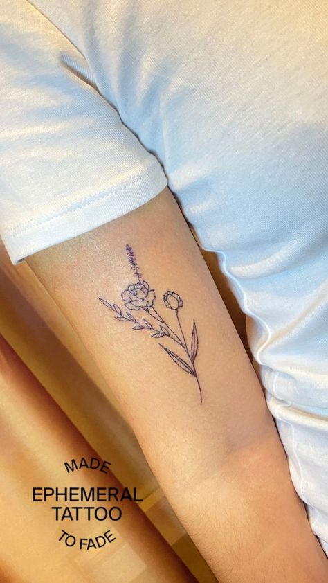 Looking for feminine tattoo ideas that feel personalized? This simple rose doesn’t just look lovely, it’s also a June birth flower tattoo. Everyone’s energy is better with a little flower power. Worried that your bloom won’t always be in-season? The floral tattoos from Ephemeral Tattoo are semi-permanent and made-to-fade in 1-3 years. Schedule your Ephemeral at ephemeral.tattoo today. Small June Flower Tattoo, Mother Daughter Flower Bouquet Tattoo, Birth Flower Rose Tattoo, Ephemeral Tattoo Ideas, June Flower Bouquet Tattoo, June Month Flower Tattoo, Rose Bouquet Tattoos, Dainty Rose Bouquet Tattoo, Rose June Tattoo