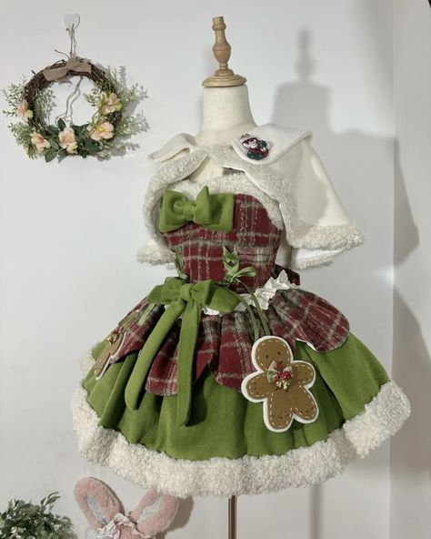 Christmas is just around the corner! 🎄 Check out our new sweet Lolita dress in festive plaid, featuring adorable gingerbread brooches. Choose from Christmas green or snowy dusty blue. Pair it with a cozy shawl and beret for the perfect winter look! Shop the full set here: https://www.devilinspired.com/della-lolita ❄️✨ #sweetlolita #lolitafashion #christmaslolita Green Christmas Dress Outfit, Kawaii Christmas Outfits, Green Outfit Christmas, Green Christmas Aesthetic, Green And Red Outfit, Gingerbread Aesthetic, Green Christmas Outfit, Gingerbread Outfit, Gingerbread Dress