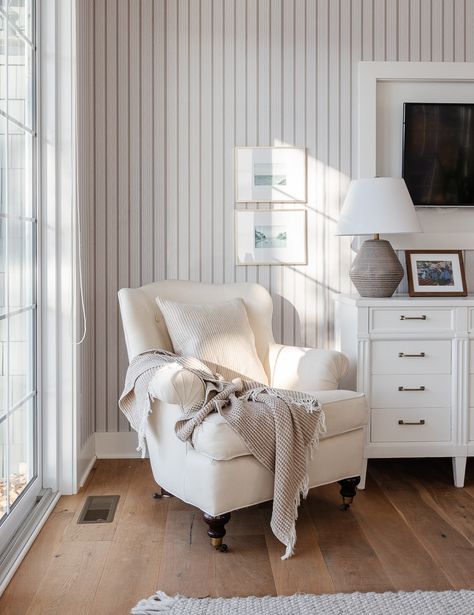 Primary Bedroom Striped Wallpaper - The Lilypad Cottage Bedroom With Armchair, Hamptons Wallpaper, Stripe Wallpaper Bedroom, Khaki Wallpaper, Honey Bee Home, Striped Bedroom, Lake House Bedroom, Downstairs Bedroom, White Armchair