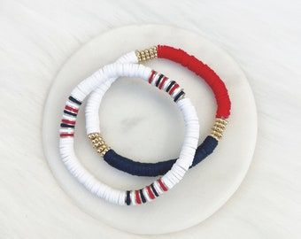 Fourth Of July Bracelet Ideas Clay Beads, Red Heishi Bracelet, Baseball Heishi Bracelet, Red White And Blue Heishi Bracelet, Patriotic Clay Bead Bracelets, Fourth Of July Clay Bead Bracelet, Disk Bead Bracelet Ideas, Flat Beaded Bracelets, Fourth Of July Bracelets