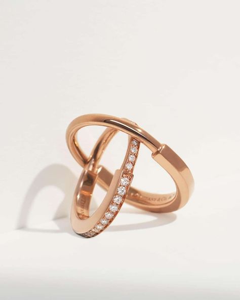 Tiffany & Co. - Tiffany Lock designs are inspired by the functionality of a padlock, an important motif from The Tiffany Archives. Expertly crafted in 18k rose gold with hand-set diamonds, this striking ring looks as good alone as it does stacked. #TiffanyLock #TiffanyAndCo Discover more: https://bit.ly/3LJWh7g | Facebook Silver Jewelry Design, Cartier Jewelry, Luxury Purses, Tiffany And Co, Luxury Life, 18k Rose Gold, Tiffany & Co., Cartier, Prada