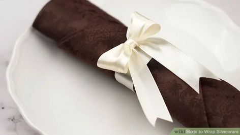 3 Ways to Wrap Silverware - wikiHow Napkin Folding Ideas With Silverware For Wedding, Flatware Wrapped In Napkins, Wrap Silverware In Cloth Napkin, How To Wrap Silverware In Cloth Napkins, Ways To Wrap Silverware In Napkins, How To Roll Silverware In Cloth Napkins, Rolled Silverware In Napkins Cute Ideas, Silverware Wrapped In Napkin, Wedding Silverware Wrap