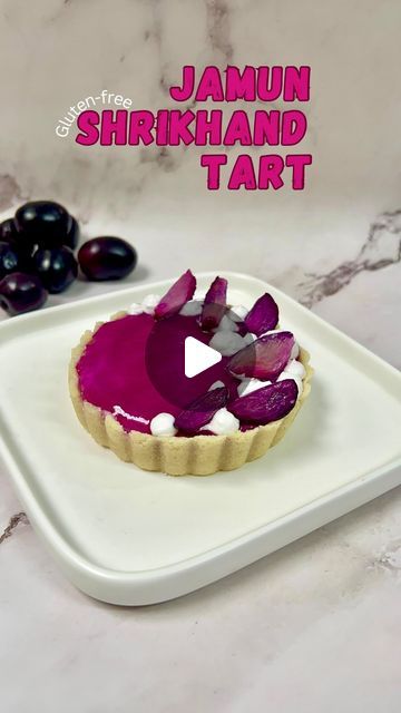 Slachi Jain | Eggless Recipes 💚 on Instagram: "Healthy Jamun Shrikhand Tart✨  Gluten-free, creamy, and bursting with flavor. Check out the full recipe and enjoy this delicious treat! It’s a no-cream tart with a touch of Indian flavour!  Note:  * For the compote recipe, check out my last video.  * For the jamun coulis, simply blend the compote and strain it for a smooth syrup consistency.   {jamun tart, healthy tart, shrikhand tart, jamun shrikhand, Java plum, Indian blackberry, Indian Java plum, no-bake tart, recipe video}  Who’s excited to try the Healthy Jamun Shrikhand Tart?" Indian Dessert Recipes Videos, Jain Food Recipe Indian, Shrikhand Tart, Healthy Tart, Shrikhand Recipe, Jain Recipes, Compote Recipe, Veg Snacks, Cream Tart