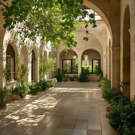 Limestone courtyard featuring arched walls and columns, perfect for outdoor building inspiration. The warm tones and natural texture of limestone create a classic, Mediterranean ambiance. Ideal for patios, gardens, or cloisters, limestone's durability and elegance add timeless charm to outdoor spaces. Elevate your landscape design with the sophistication and organic beauty of limestone. Mediterranean Columns, Desert Courtyard, Limestone Building, Limestone Architecture, Courtyard Building, Building Materials Architecture, Mediterranean Courtyard, Garden Home Ideas, Materials Architecture