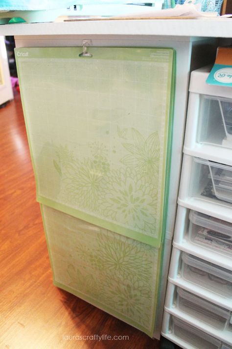 Cricut mat storage - use a command hook near your work surface to have easy access to your Cricut mats #cricut #mat #storage #organization Cricut Storage, Craft Shed, Cricut Supplies, Cricut Mat, Scrapbook Storage, Scrapbook Organization, Dream Craft Room, Craft Room Design, Sewing Room Organization