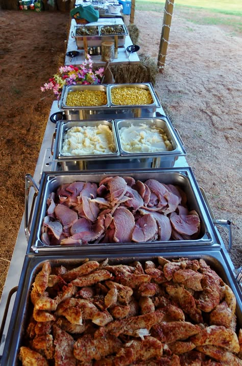 Country buffet for a wedding reception under an open barn.  Chicken tenderloin in herb sauce, dinner ham, mashed potatoes, green beans, buttered corn, slaw, rolls. Chicken Tenderloin, Wedding Food Drink, Buttered Corn, Reception Food, Hanging Ideas, Wedding Reception Food, Wedding Buffet, Buffet Food, Wedding Dinner