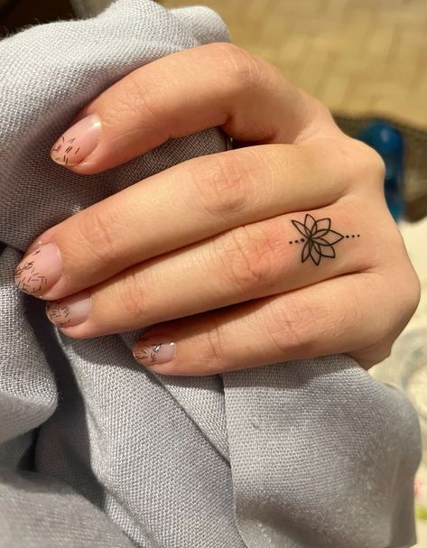 Ohm Finger Tattoo, Women Finger Tattoos Ideas, Female Finger Tattoos, Tattoos For Women Finger, Lotus Finger Tattoo, Ring Finger Tattoo For Women, Finger Ring Tattoo, Tattoo Designs Finger, Flower Finger Tattoos