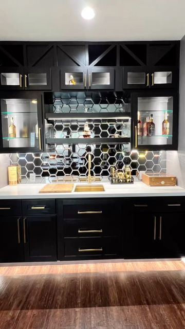 Black And Gold Wet Bar, Home Bar Mirror Backsplash, Black Bar Cabinets Modern, Mirror Backsplash Bar, Black Wet Bar, Speakeasy Ideas, Basement Speakeasy, Black Bar Cabinet, Dry Bar Ideas