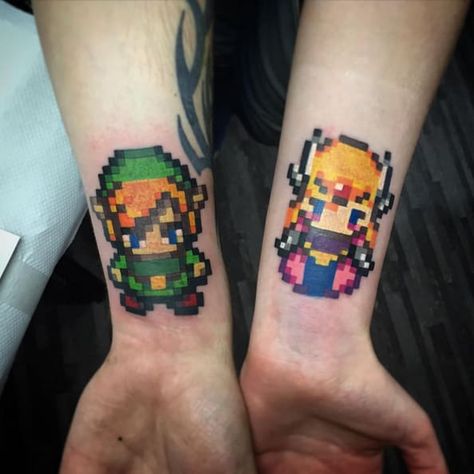 22 "Legend Of Zelda" Tattoos That Will Blow You Away Heart Ring Tattoo, Zelda Heart, Pixel Tattoo, Video Game Tattoos, Zelda Tattoo, Gamer Tattoos, Back Of Shoulder Tattoo, Gaming Tattoo, Ring Tattoos