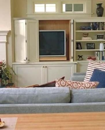 Hiding TVs behind hinged and sliding doors or wall decorative panels is one of interior design trends and modern ideas for home staging Built In Tv Cabinet, Hidden Tv Cabinet, Tv Cupboard, Contemporary Family Room, Tv Built In, Retractable Door, Tv Cabinet Design, Hidden Tv, Basement Renovation