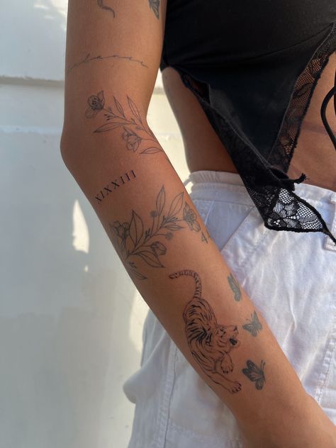 Fineline sticker tattoo sleeve butterflies tiger tattoos Tattoo Sleeve Butterfly, Dainty Sticker Sleeve Tattoo, Dainty Tattoo Arm Sleeve, Tattoo Ideas Tiger Women, Dainty Women’s Tattoos, Line Tattoos For Women Arm, 2025 Tattoo Ideas, Delaney Childs Tattoo, Fine Line Tattoo Tiger