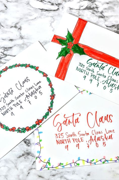 Send your Christmas cards with a little bit of extra cheer this year with these three DIY envelope designs. Decorated Christmas Envelopes, Diy Christmas Cards Calligraphy, Christmas Card Lettering Envelope, Christmas Envelopes Art, Hand Addressed Christmas Envelopes, Christmas Card Addressing Handwriting, Christmas Envelope Art Cute Ideas, Address Christmas Cards Envelopes, Christmas Envelope Art Diy