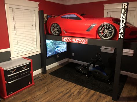 Bed frame made to look like a four post car lift. Xbox gaming station underneath. Car Bed Makeover, Kid Car Beds, Car Loft Bed, Diy Race Car Bed, Cool Toddler Beds For Boys, Car Themed Rooms For Boys, Car Room Decor Men, Race Car Room Boys, Boys Race Car Bedroom