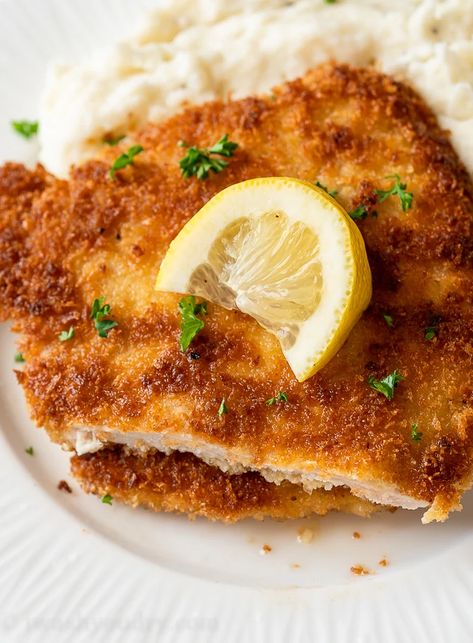 Crispy Pork Schnitzel starts with a thinly pounded pork chop and it breaded and fried until golden brown. Crispy Pork Schnitzel, Pork Snitzel, Pork Schnitzel Recipe, Pork Cutlet Recipes, Schnitzel Recipe, Boneless Pork Chop Recipes, Schnitzel Recipes, Breaded Pork Chops, Easy Pork Chops